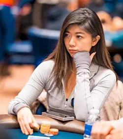 Xuan Liu at a poker table with chips