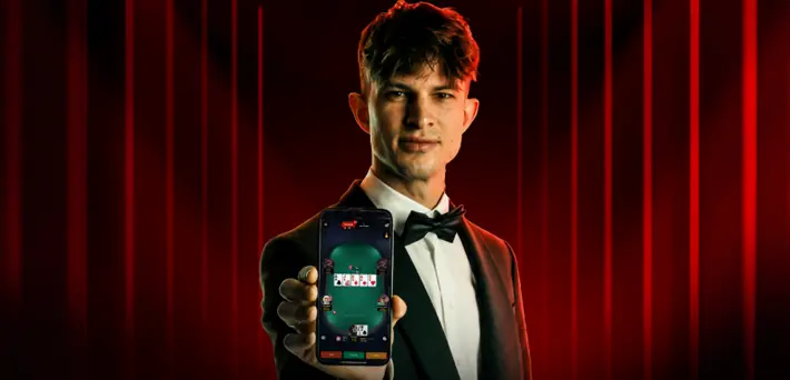 CoinPoker new app March 2, 2026 - Full platform migration Player holding CoinPoker's new mobile app launching with the full platform migration on March 2, 2026