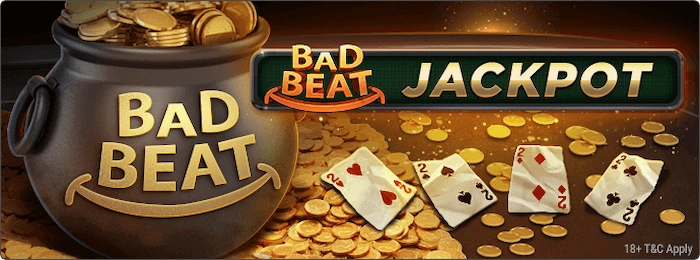 Alt Text:
Bad Beat Jackpot promotional graphic featuring a treasure pot overflowing with gold coins, scattered playing cards showing a bad beat hand (e.g., 2♠ 2♥ 2♦ 2♣ and higher cards), bold "BAD BEAT JACKPOT" banner in gold and green, coins raining down on a dark dramatic background