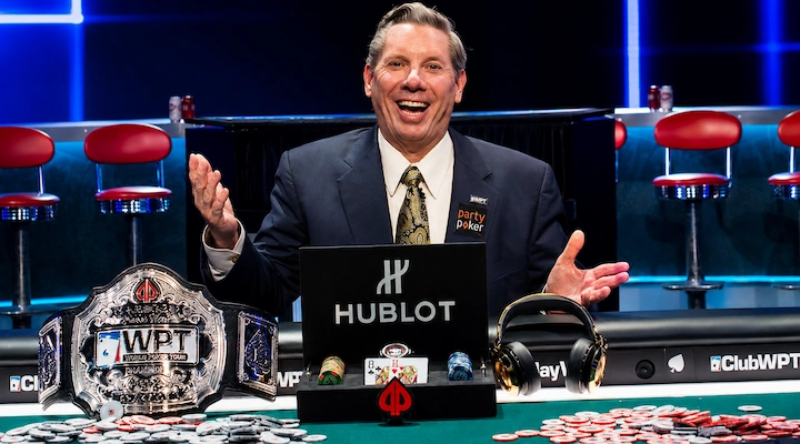Mike Sexton at the World Poker Tour final table with the WPT championship belt, the Ambassador of Poker who commentated for 15 seasons